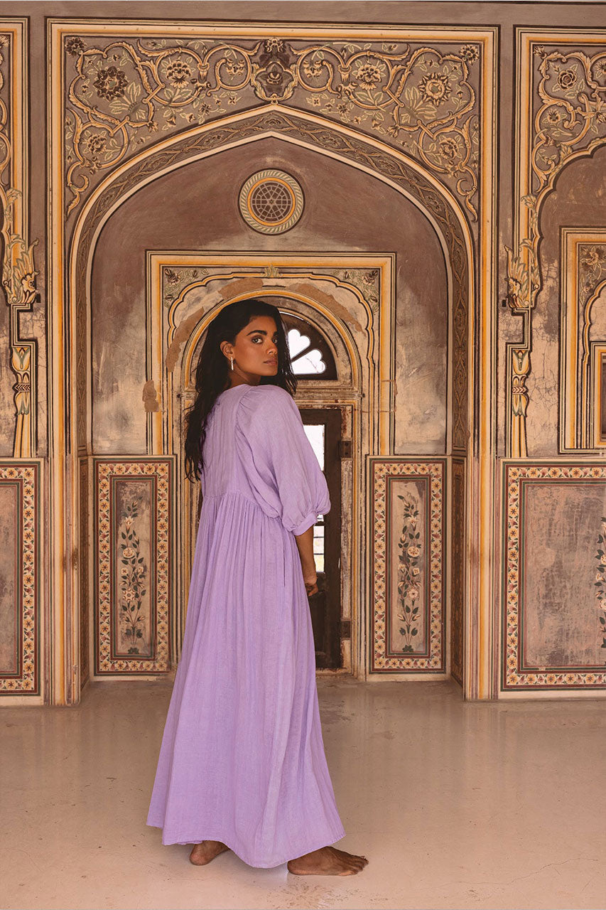 Daughters of India Kyra Maxi Dress in Lilac Gauze — back view in palace archway, gathered waist, cotton gauze