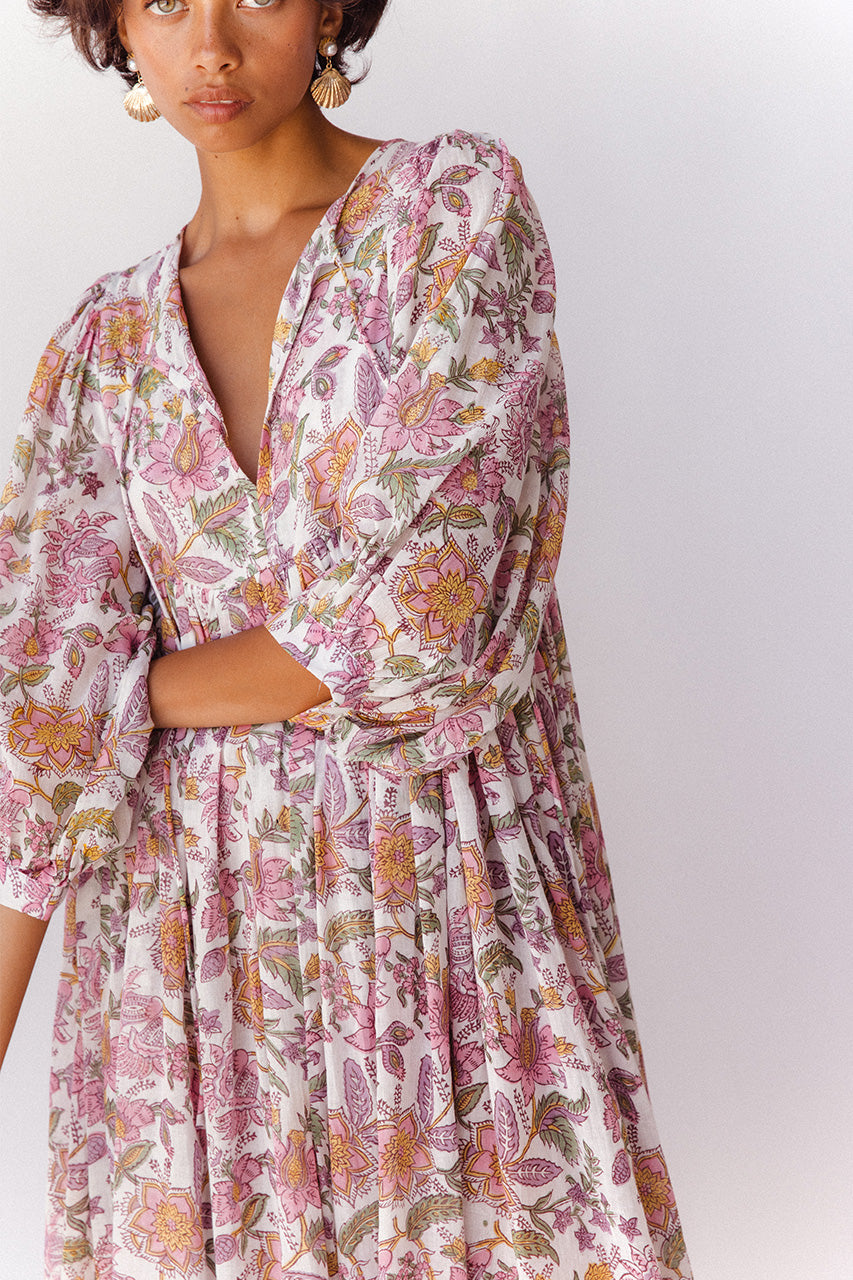 Daughters of India Kyra Midi Dress in Fuchsia Bloom — studio close-up V-neckline with hands crossed, hand screen print