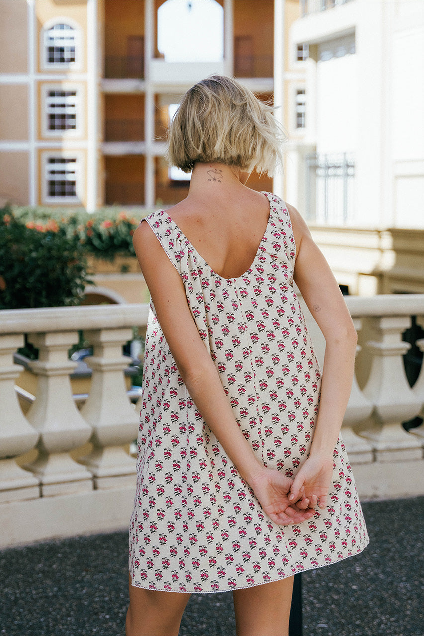 Sundress Mini Peony — back view showing scooped back neckline, hand block print peony floral cotton mini dress, A-line silhouette, classical architecture | Daughters of India